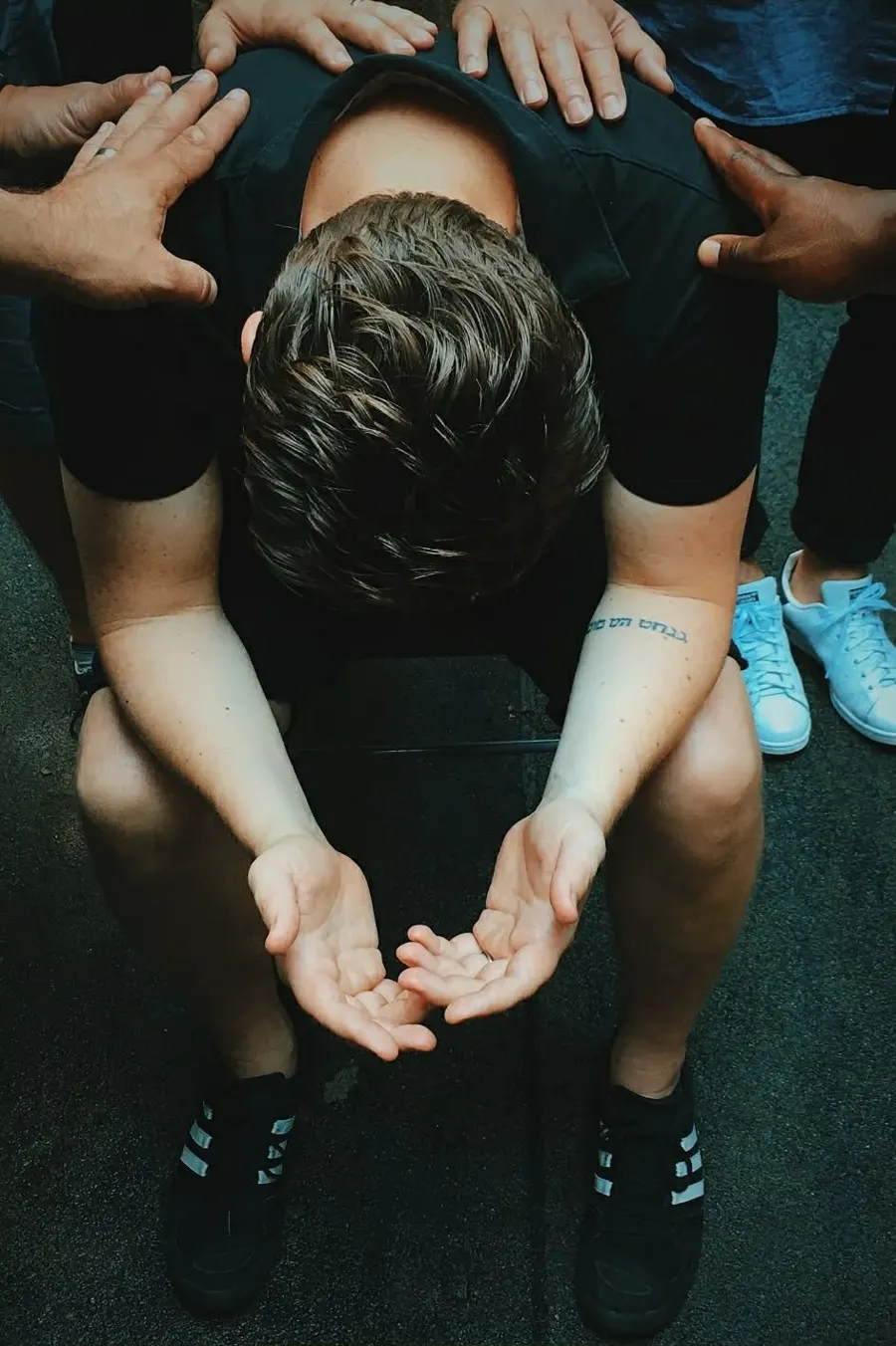 Open hands raised in surrender